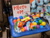 Size: 3648x2736 | Tagged: safe, rainbow dash, pegasus, pony, harmonycon, g4, ball pit, chair, dashcon, female, harmonycon 2025, photo, plushie