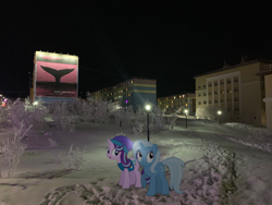 Size: 1066x800 | Tagged: safe, artist:mundschenk85, artist:parclytaxel, artist:slavaboobrony, artist:zslnews, starlight glimmer, trixie, pony, unicorn, g4, my little pony: friendship is magic, anadyr, chukotka, city, clothes, commieblocks, cute, diatrixes, fanfic art, female, happy, hat, horn, irl, looking up, mare, night, open mouth, outdoors, photo, plattenbau, ponies in real life, raised hoof, russia, siberia, snow, starlight glimmer is not amused, streetlight, unamused, weather team, winter outfit, winter wrap up vest